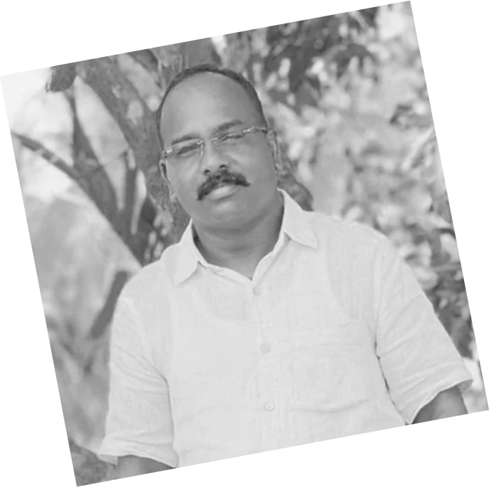 Early black-and-white portrait of Manikandan K